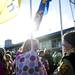 Saline High School juniors Erin Stauder (left) and Elizabeth Sanderson (right) hold flags and talk during an award ceremony on Saturday. Daniel Brenner I AnnArbor.com
